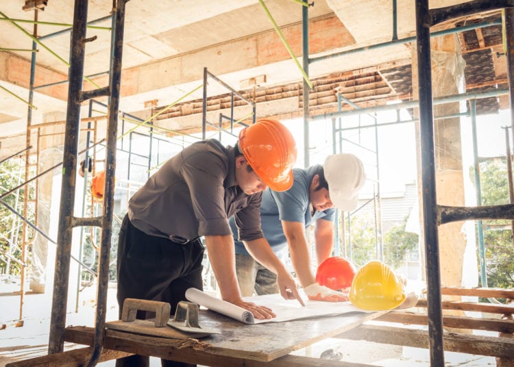 two business man construction site engineer, effect sun flare