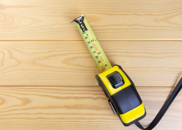 Tape Measures On Wooden Floor