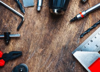 Different construction tools with Hand tools for home renovation on wooden board maintenance and reparing concept.