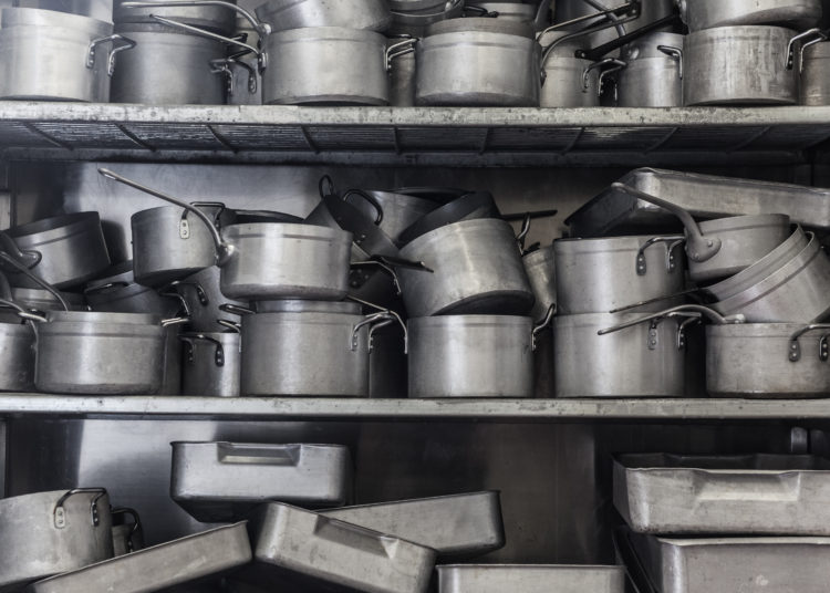 Shelf full of pans all in chrome