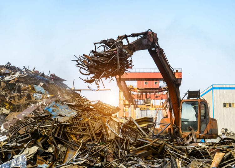 Grab crane works in waste recycling station