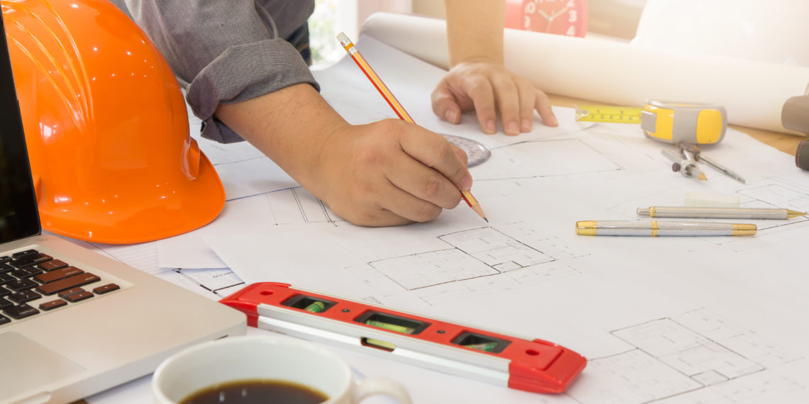 Architect concept, Architects office working with blueprints