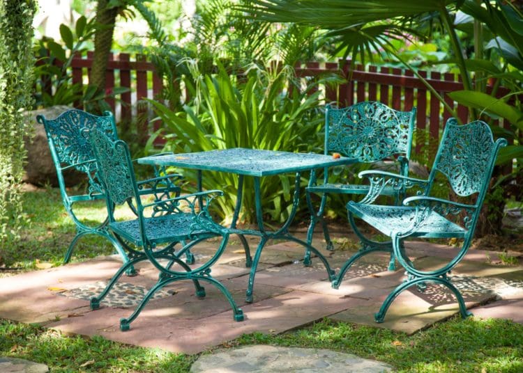 Chairs and tables, located in the garden made ​​from metal to sit in the garden.