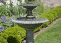 Beautiful fountain in the garden, summer time