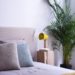 Modern bedroom with yellow modern light on the cupboard