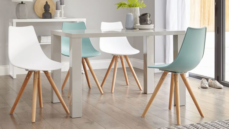 Modern grey dining table with blue and white chairs