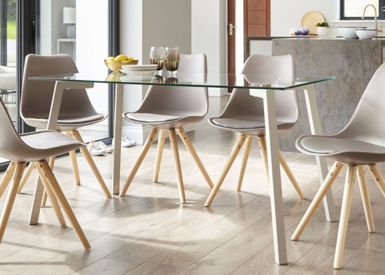 Modern glass dining table with grey chairs