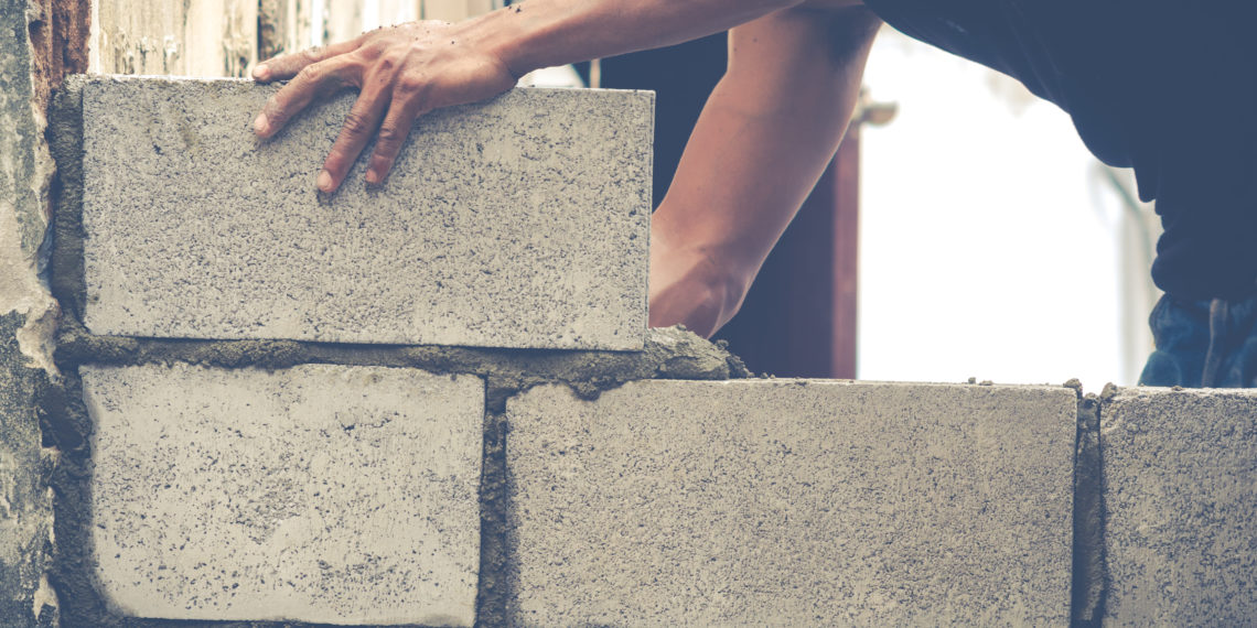 Brick Builders Are Building Walls of the house