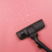 A vacuum cleaner on the pink background