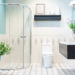 Modern spacious bathroom with bright tiles with glass shower, toilet and sink. Side view