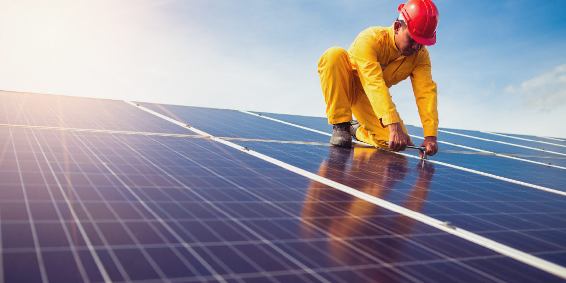Engineers checking solar panels setup