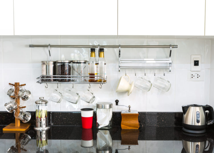 Kitchen cabinets with coffee corner in modern home living room.