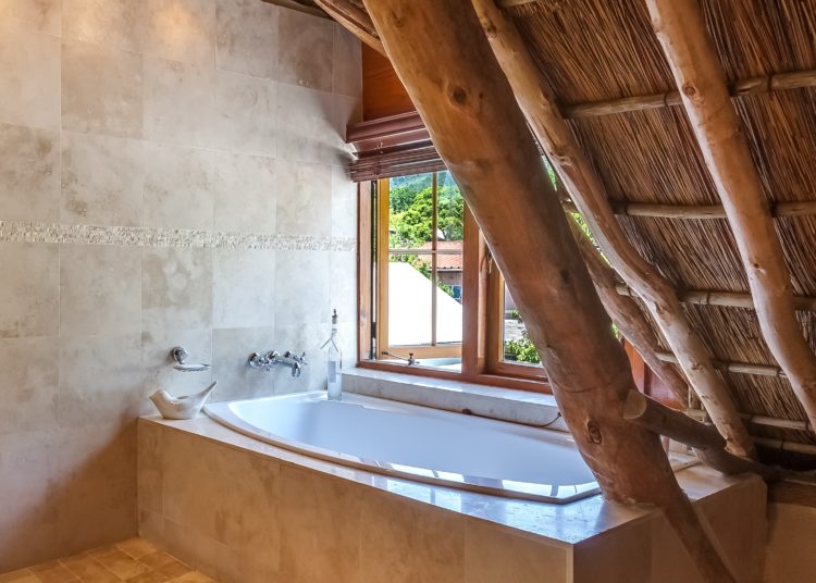 Modern spacious bathroom with bathtub. 