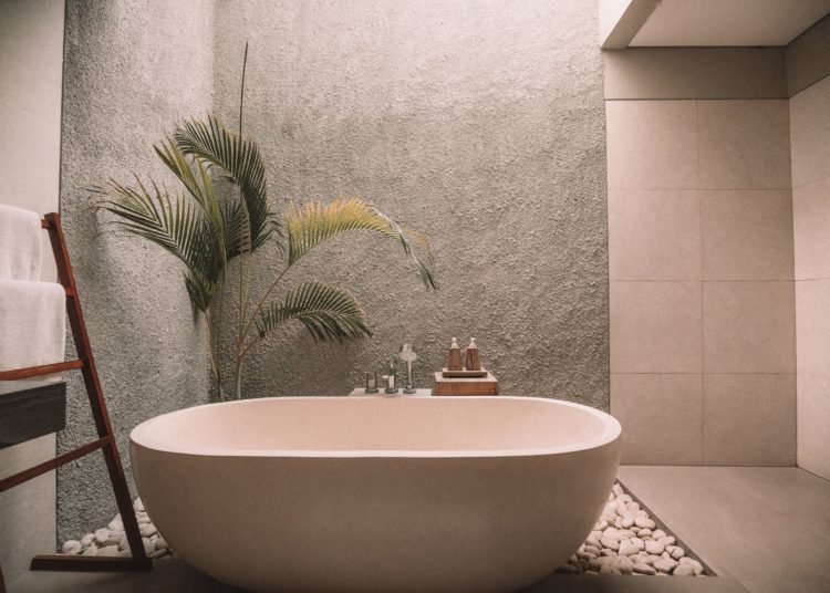 Modern spacious bathroom with bathtub. 