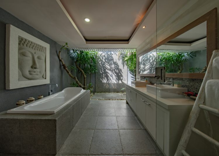 Modern spacious bathroom with bathtub. 