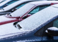 Snow covered cars in the parking, close up. Antifreeze was not used. Vehicles in snow. Winter time is coming. Bad weather conditions