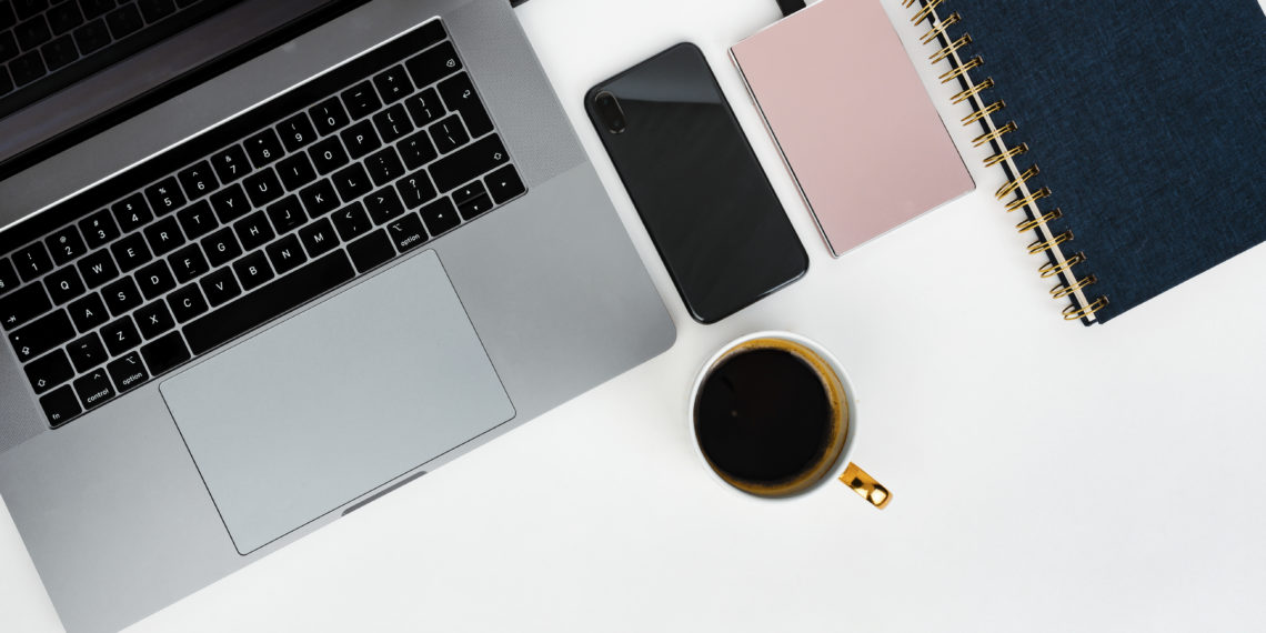 Pink external hard disk connecting to a laptop