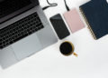 Pink external hard disk connecting to a laptop