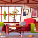 Messy living room with dirty dishes on table, spider web on ceiling and clothes scattered on stained carpet cartoon vector illustration. Household chaos, home cleaning time or bad tenant concept