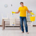 Man cleaning the house helping his wife