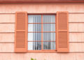 Vintage window with orange tone wall