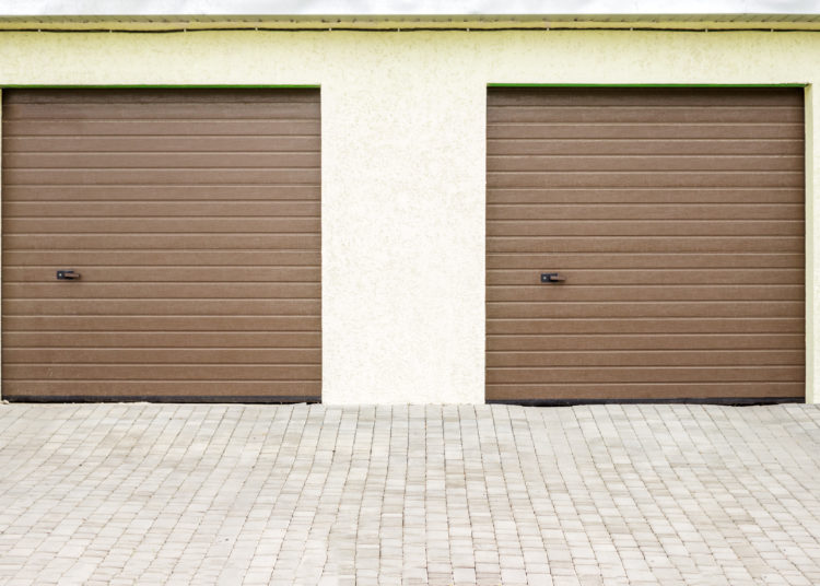 Pair of modern garage doors. Large automatic up and over garage doors for a wealthy holiday home.