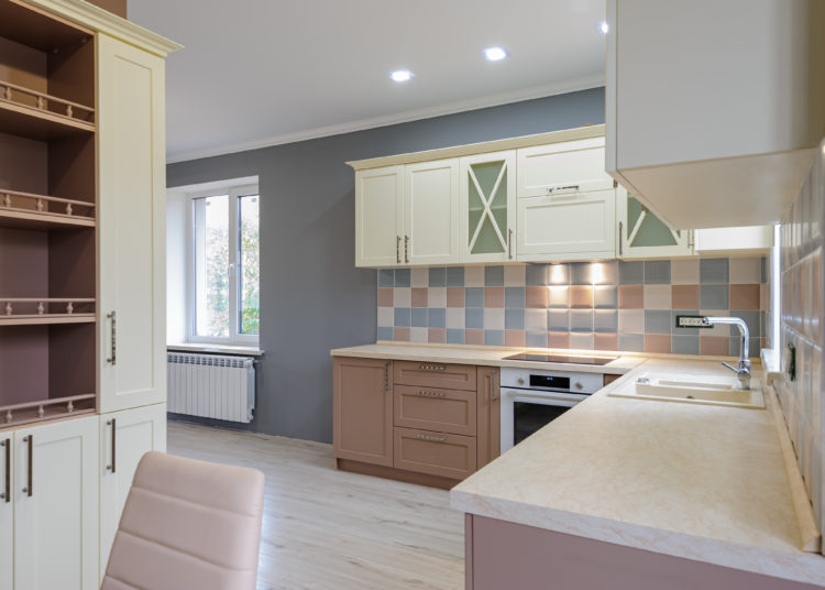 Luxury provence styled modern grey, pink and cream colored kitchen interior