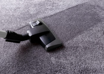 Grey carpet texture and cleaner, close up, indoors interior design