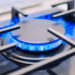 Burning gas burner on the stove. Photo with shallow depth of focus.