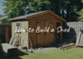 A well-built wooden shed in a backyard, tools and lumber nearby, sunny day, realistic.