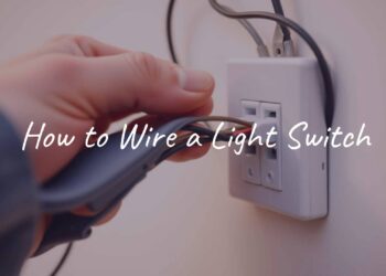 A hand wiring a light switch, close-up, electrical wires visible, realistic, DIY home improvement vibe.